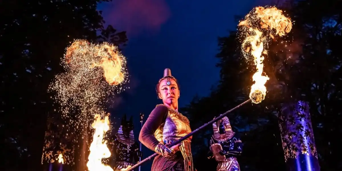a woman wearing a gold costume with a firebrand halloween blenheim palace