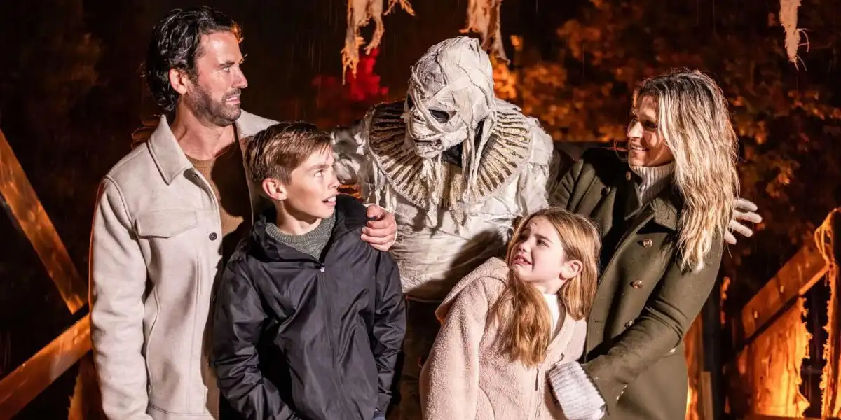 two parents with children pretending to be scared by a mummy halloween blenheim palace