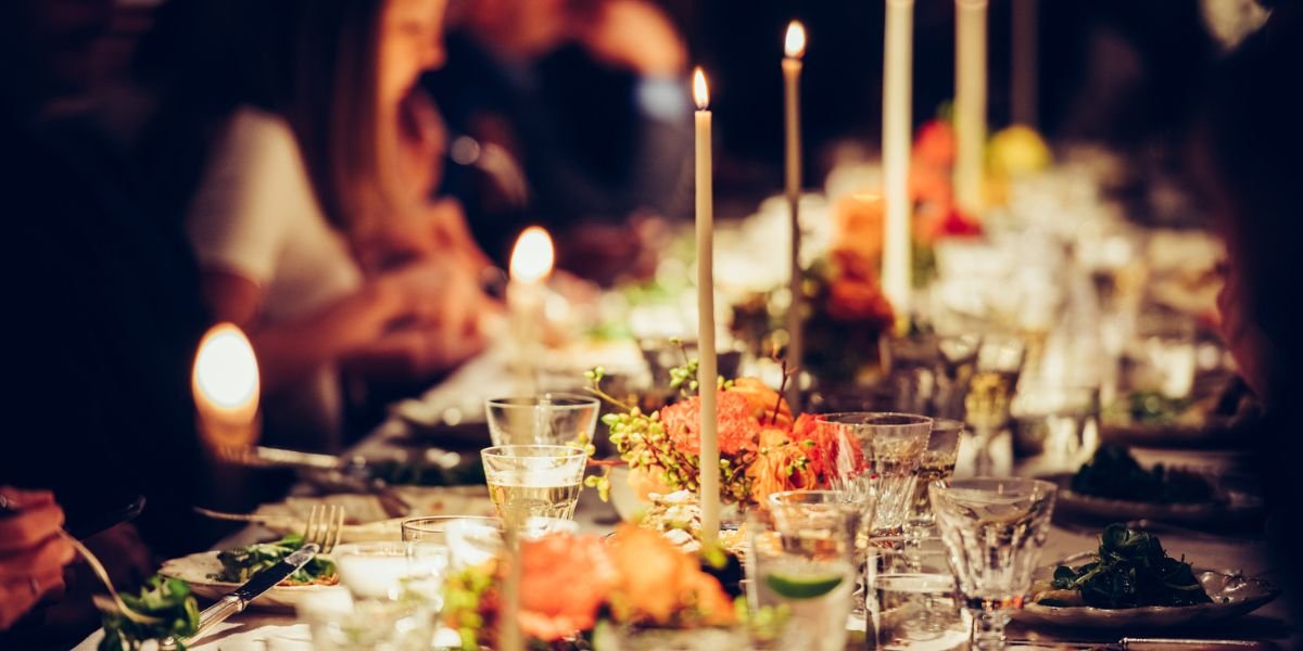 people enjoying a meal at a decorative table