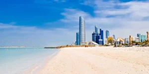 the beach and city skyline with skyscrapers abu dhabi sun this winter