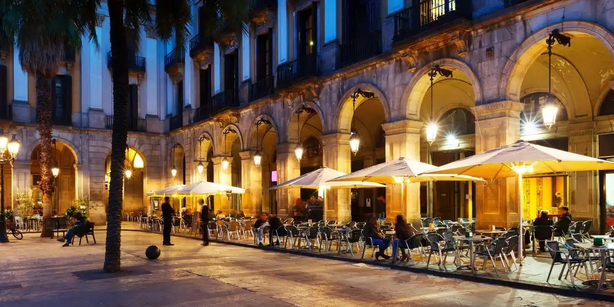 European cities girls trip - a square in Barcelona with tables and chairs outside