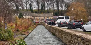 Picturesque village in the cotswolds with a river in the foreground where to stay in the cotswolds