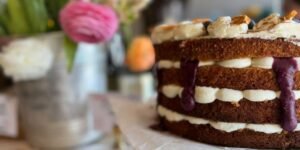 brunch in york, close up image of a layered cake with flowers in the background