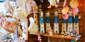 colouful display of decorative lighthouses in a shop front