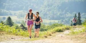 two runnewrs in the mountains near keswick for the festival