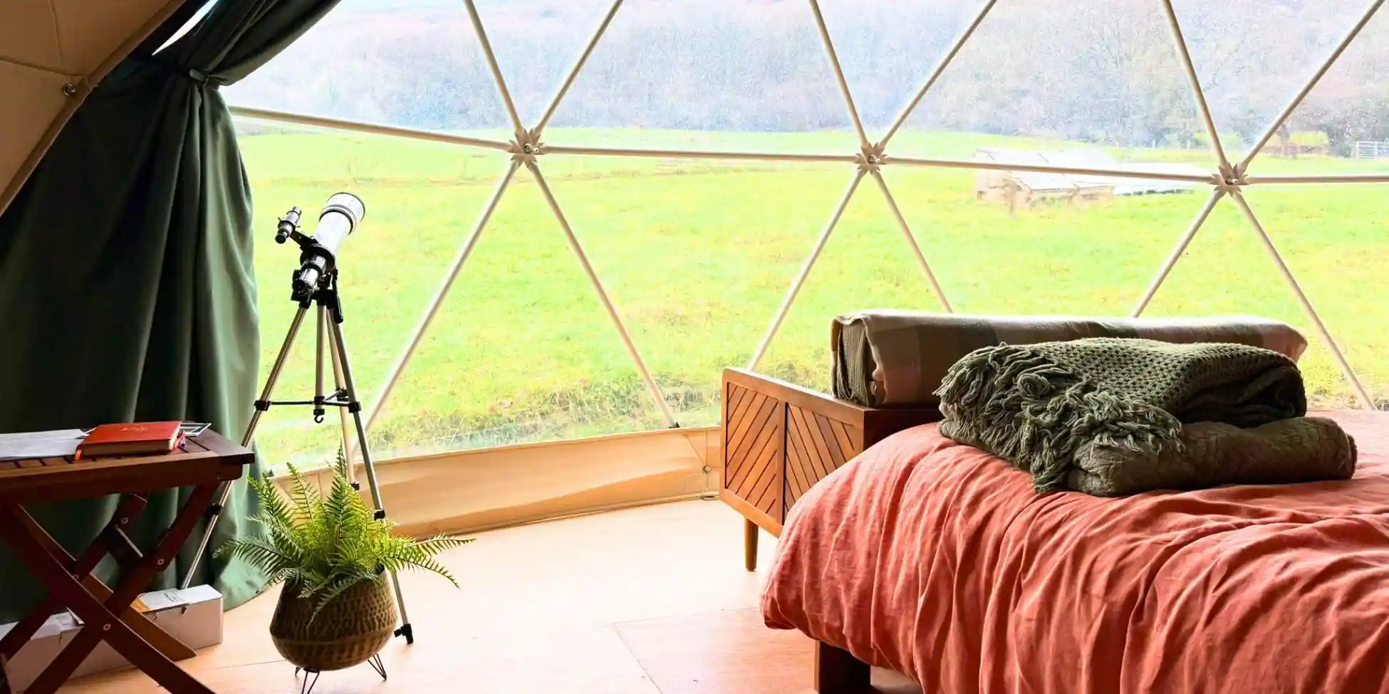 glamping in the brecon beacons the view out over woodland from a glamping pod