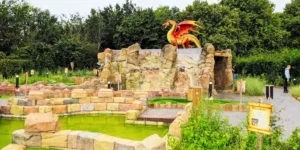 adventure golf with a big red dragon in the background