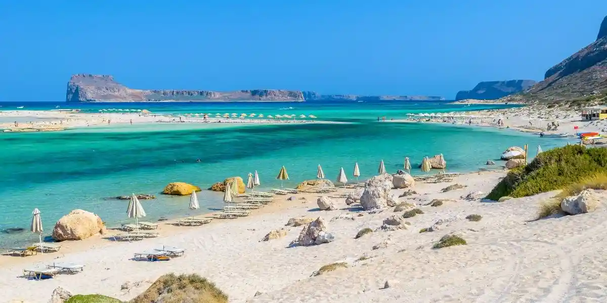 Umbrellas on Balos beach on Crete island, Greece. Balos beach is one of the most popular beaches on Crete island, budget friendly beach destinations
