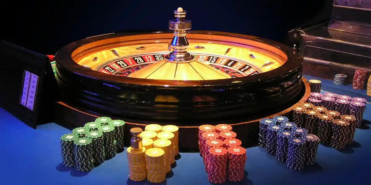 Casino roulette wheel on the table surrounded by chips. The digital nomad’s guide to playing online casino games safely overseas