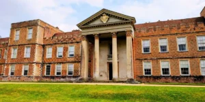 brick built building with columns around the door