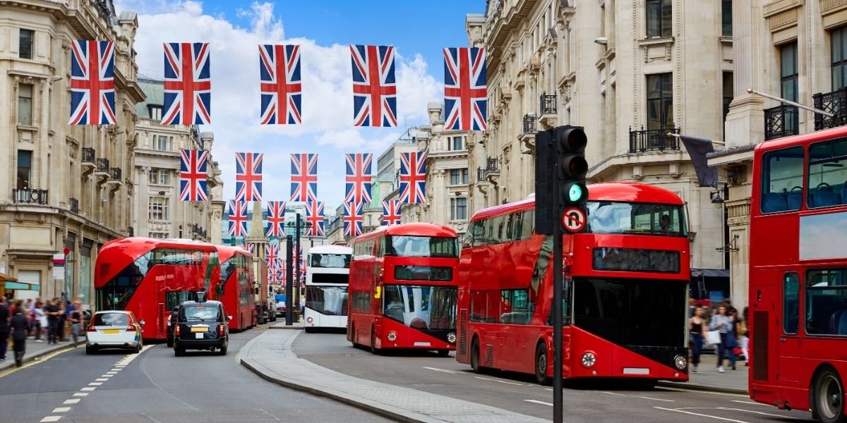 london buses on regent street with union flag bunting