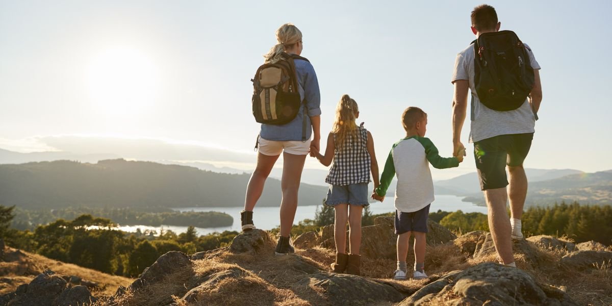 a family outside enjoying nature on a hike