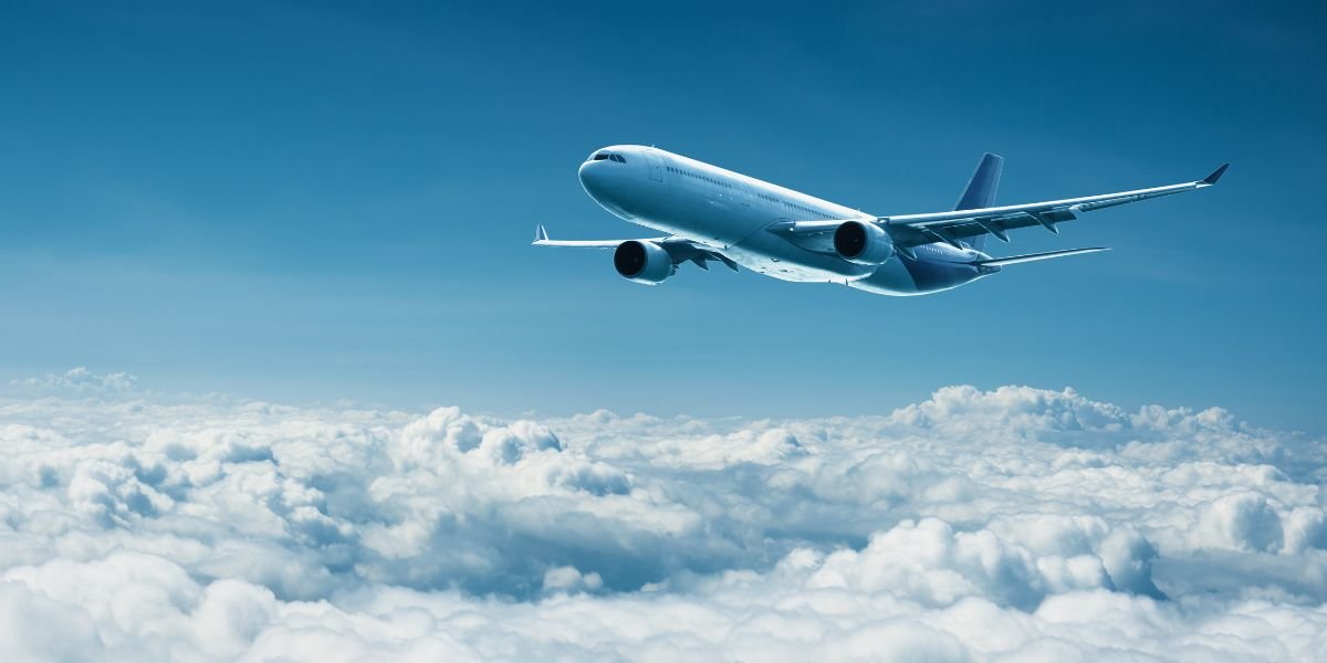 Airplane flies above clouds - air travel. Passenger plane flies above the clouds - air travel