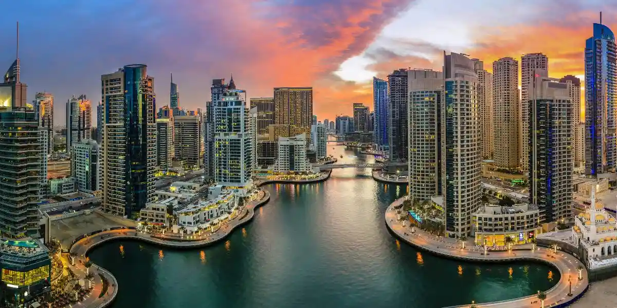 arial view of dubai marina with tall buildings around the water