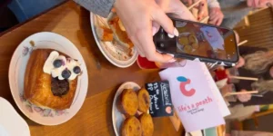 Lifes a peach cafe with pastries on the table