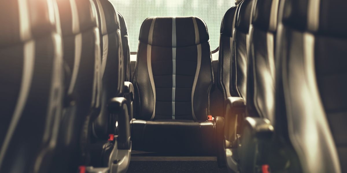 seats on the inside of a coach transferring people to stanstead airport