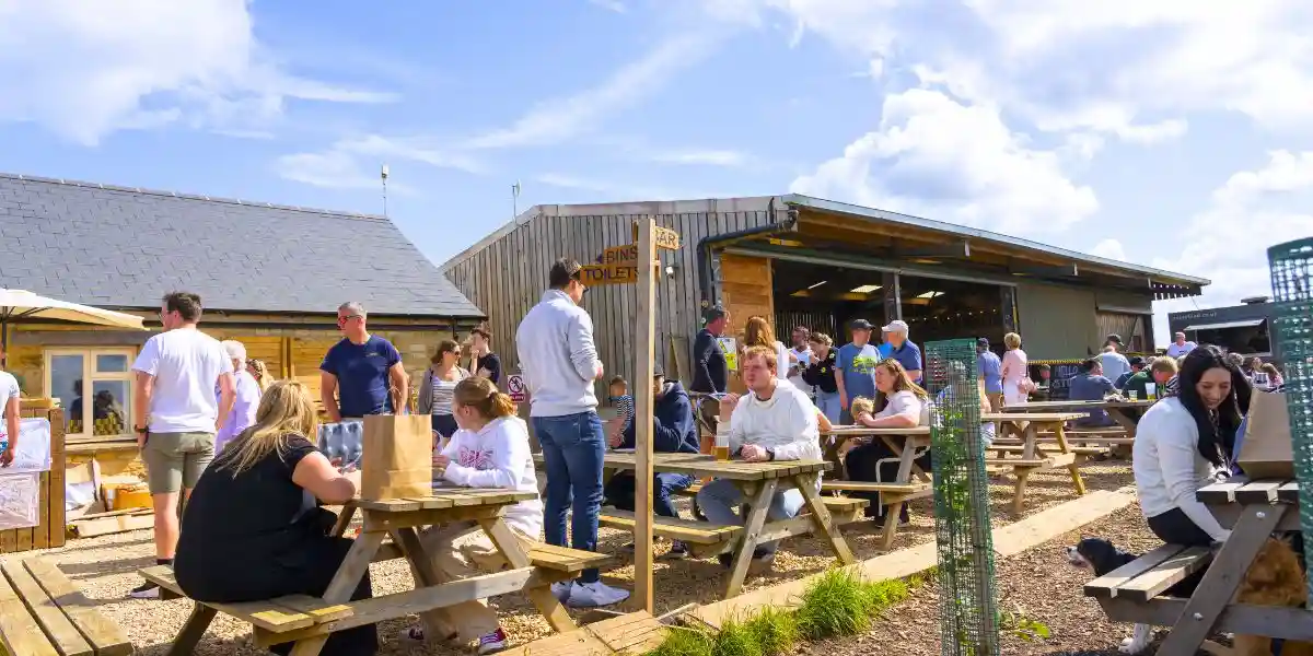 people drinking outside a pub
