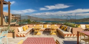 a seating area in Crete with the mountain in the background