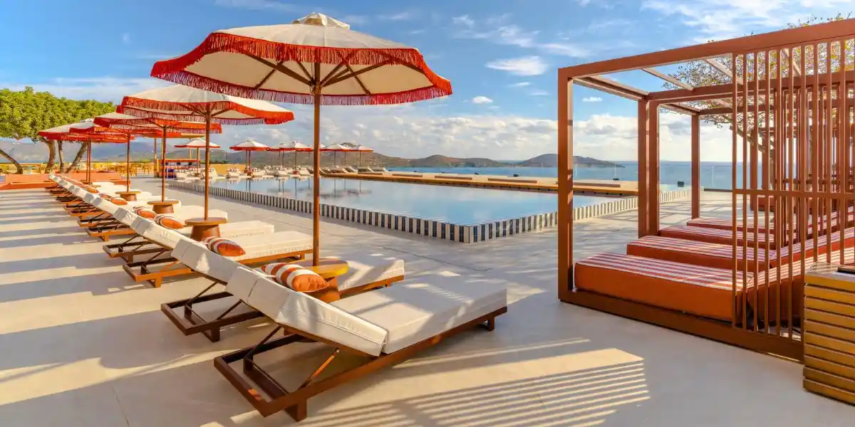 sunloungers at the side of a beautiful swimming pool in Crete