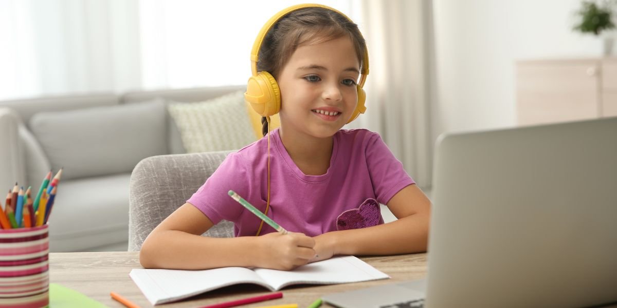 online primary school Girl having online school lesson