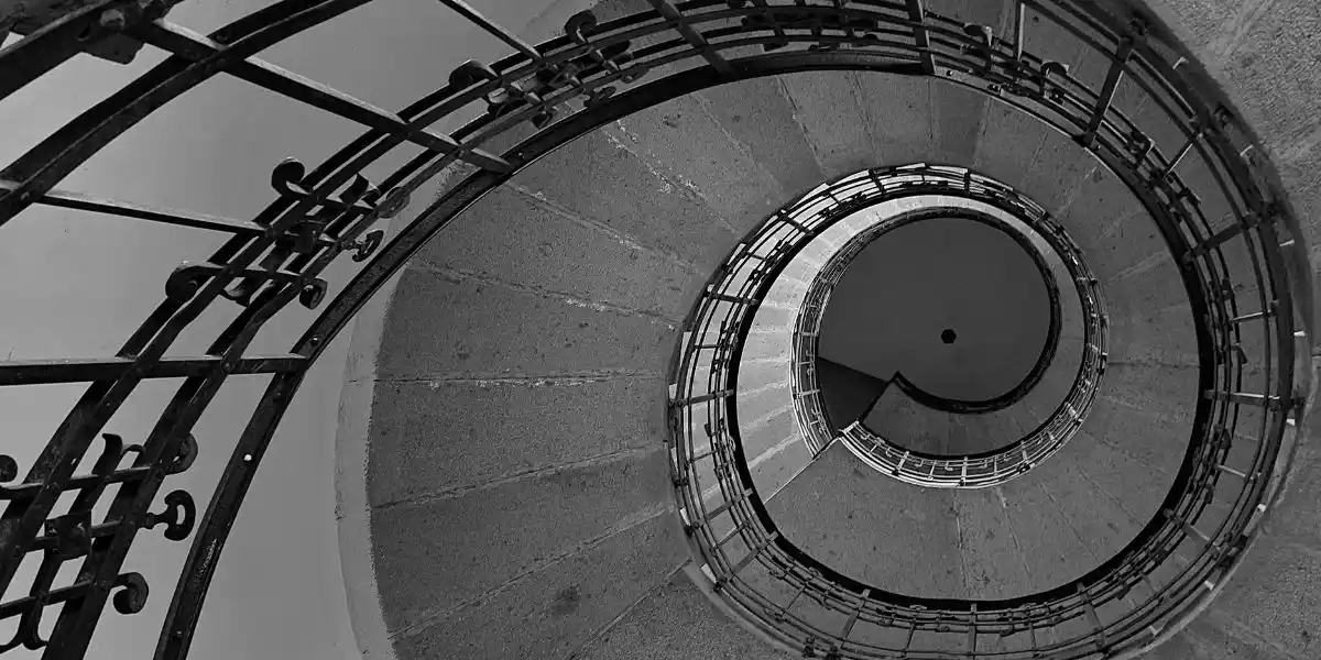 Spiral stairs in an old historical church which gives the fibonacci spiral look. concept of patterns