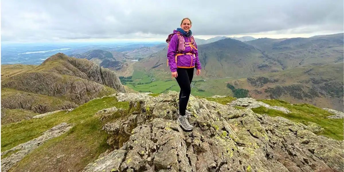 woman on a mountainside wearing Salomon Quest boots