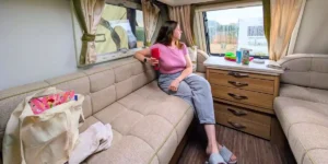 woman in a caravan looking out of the window