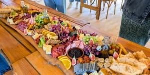 a charcuterie board filled with food