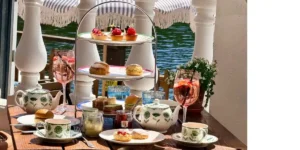a table set with cakes for afternoon tea