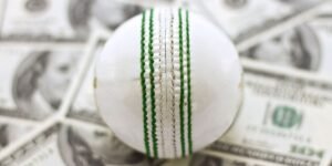 Cricket ball on some money sports betting concept