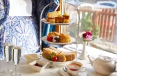 east lancashire railway afternoon tea. set out in a carriage with sandwiches and a teapot