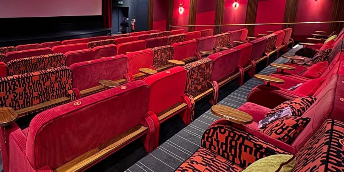 the interior of a brightly coloured everyman cinema