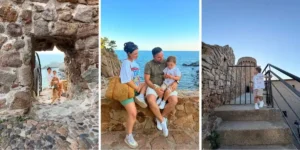 young family sitting on a stone wall in the sunshine