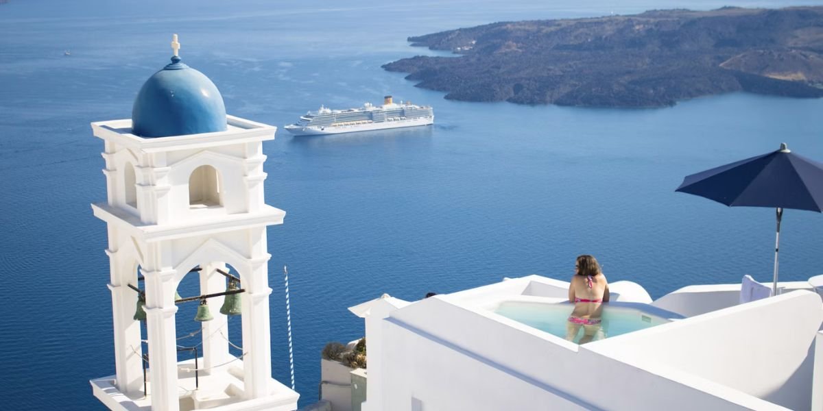 unsplash solo 5 star travel concept. woman in pool overlooking an Aegean setting with a large ship in the sea