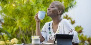 woman enjoying a coffee while staying connected online using her esim