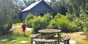 a chalet in a green garden