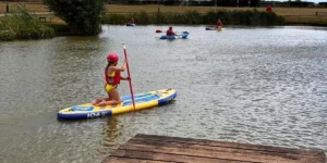 young girl paddle boarding at love2stay in shrewsbury
