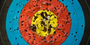 an archery target with holes in it