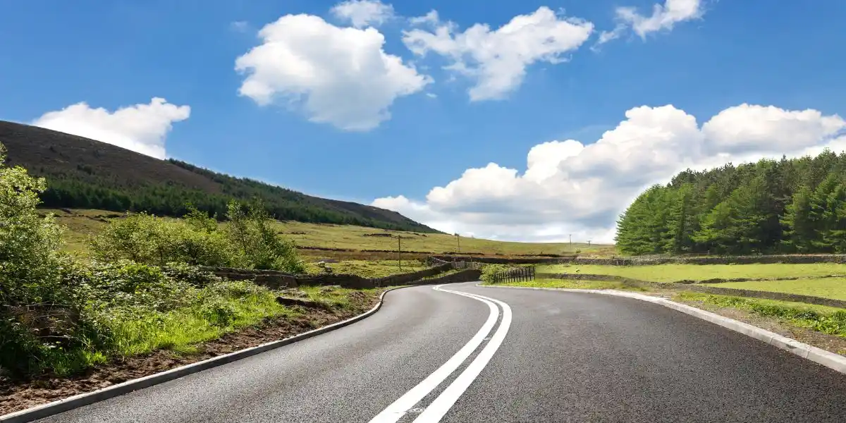 Empty curved road, Yorkshire, uk Concept of travelling by car