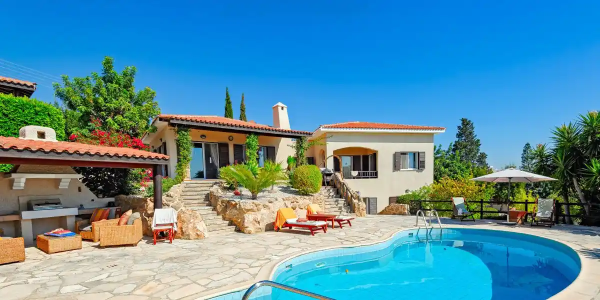 a beautiful villa in cyprus with a swimming pool in the foregraound