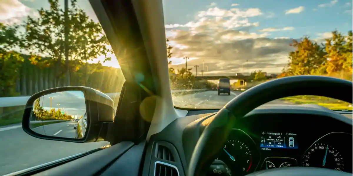 inside a car in hungary looking out to the sunshine