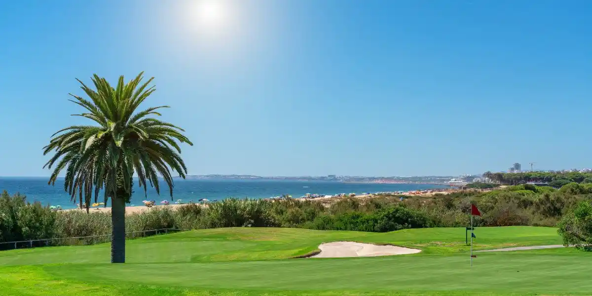 Resort luxury beaches, golf courses with palm trees, overlooking the sea for tourists to relax. Portugal algarve. Golf Hire