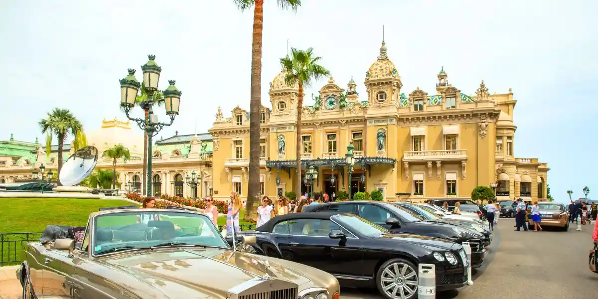 monte carlo an old building with expensive cars