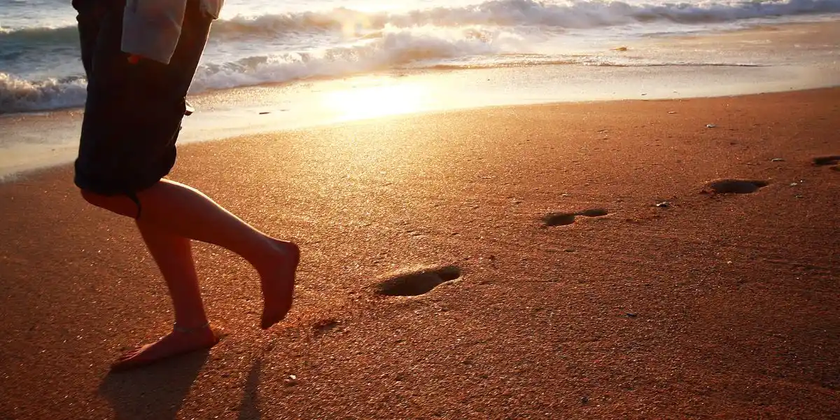footprints in the sand in cornwall