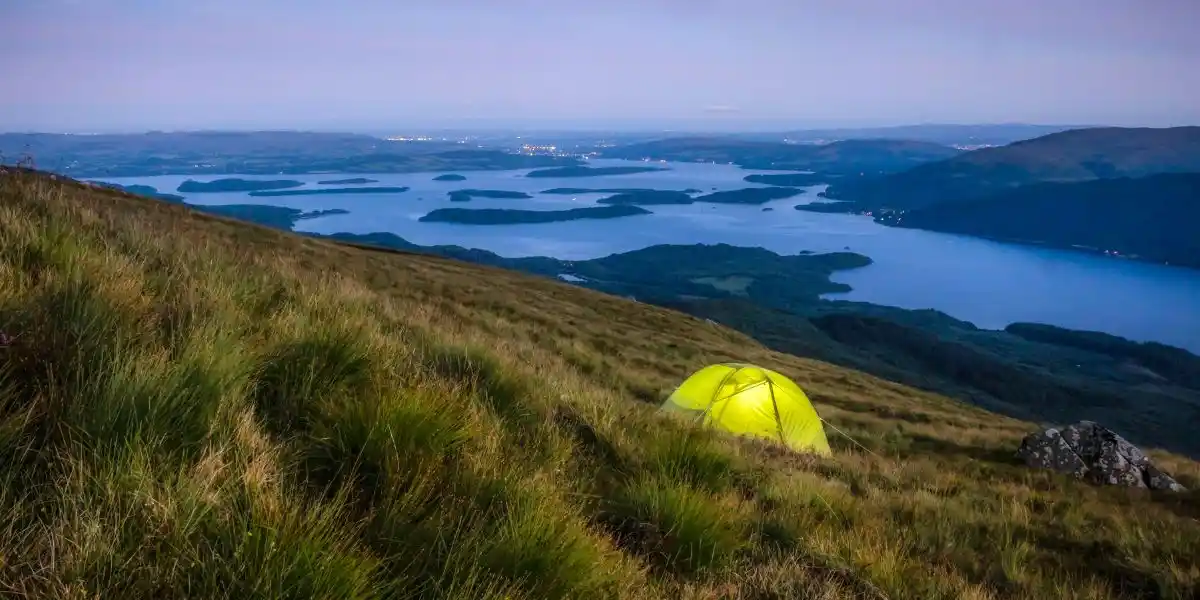 a green tent wild camping in scotland.