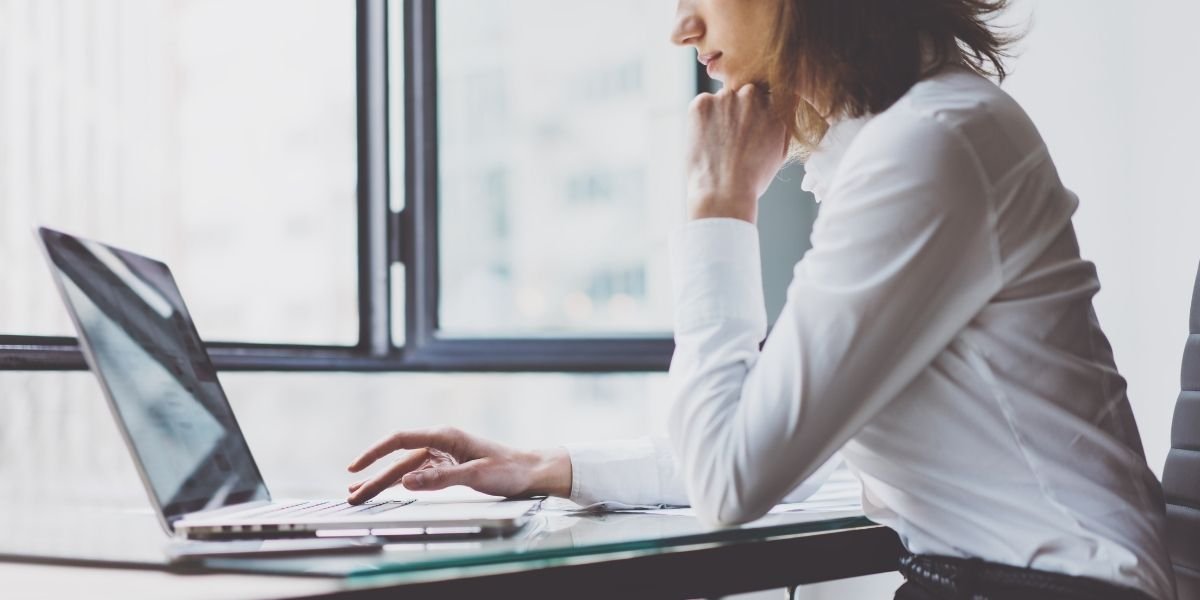 a woman pondering the performance of her crypto deposits
