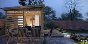 log cabin in a garden at twilight