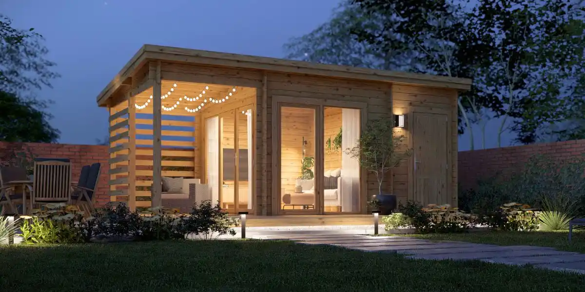 a beautiful log cabin in a garden at twilight