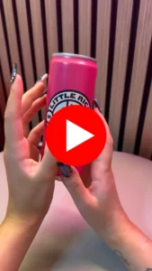 hands holding a drinks can with a link to instagram