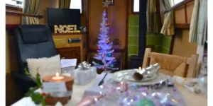 interior of a canal boat with a christmas tree